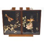 A pair of 20th century Japanese silkwork pictures of birds flying over a flowering branch,