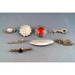 A selection of eight silver brooches, to include three gem set,