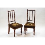 A pair of Victorian mahogany side chairs with bobbin turned backs,