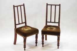 A pair of Victorian mahogany side chairs with bobbin turned backs,