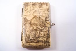 A 19th century Dieppe ivory card case with penwork detail of a harbour town and mountain landscape,