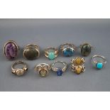 A selection of ten silver dress rings set with multiple stones. Total Gross weight : 65.