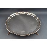 A silver salver, on three flared feet, 20cm diameter, Sheffield 1971, 10.