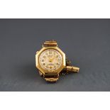 A yellow gold Accurist wristwatch. Round champagne figure dial with additional second hand dial.