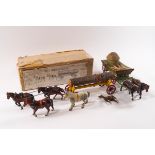 A Britains lead straw cart, pulled by two horses,
