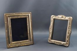A silver photograph frame with reeded and ribbon borders, overall 13cm x 10.