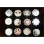 Twelve H M Queen Elizabeth the Queen Mother official coin collection, mostly crown sized coins,