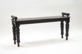 A 19th century stained oak window seat on turned legs, 53cm high x 108cm wide x 27.