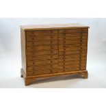 A pine collector's chest of twenty two drawers,