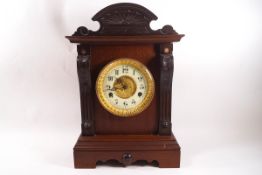 An Edwardian mahogany mantel clock, the movement striking on a gong by The United Clock Co Ltd,