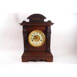 An Edwardian mahogany mantel clock, the movement striking on a gong by The United Clock Co Ltd,