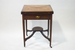 A 19th century rosewood envelope card table with single drawer upon square tapering legs joined by