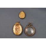 A selection of Victorian pendants consisting of two rolled gold lockets (both stamped 9ct back &