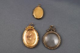 A selection of Victorian pendants consisting of two rolled gold lockets (both stamped 9ct back &