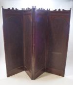 A Victorian mahogany and leather four fold screen with carved crest rail,