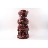 A Victorian treacle glazed Toby jug and lid,