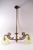 A 19th century brass two branch ceiling light with vaseline glass shades,