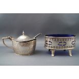 A Victorian silver mustard pot and spoon of oval form with hinged cover opening to reveal a blue