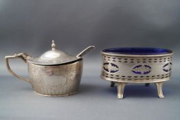 A Victorian silver mustard pot and spoon of oval form with hinged cover opening to reveal a blue