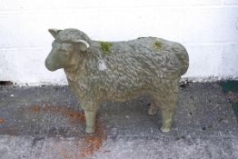 A reconstituted stone garden sheep (weathered),