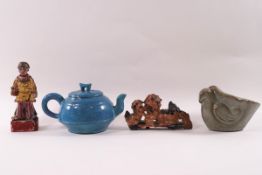 A Chinese earthenware blue glaze teapot, a hardstone carving of two dragons,