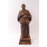 An 18th century Continental painted terracotta figure of a chorister,