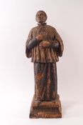 An 18th century Continental painted terracotta figure of a chorister,