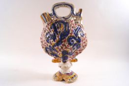 An 18th century Delft earthenware ewer, in the form of a scallop shell, 27.