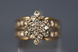 A yellow and white gold cluster ring, set with thirty four round brilliant diamonds,