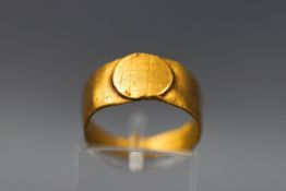 A yellow gold signet ring. Tests indicate high gold standard of at least 22ct. Size M. 4.