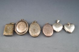 A selection of picture lockets of variable shapes/sizes.