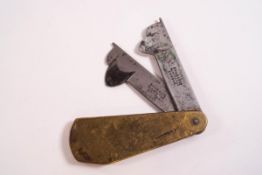 A 19th century brass fleam with two steel blades, stamped 'Evans & Co Oldchange, London', 8.