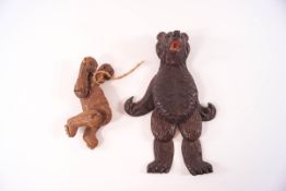 Two small Black Forest carved wooden bear puppets, with moveable arms and legs, 8.5cm high and 14.