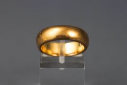 A yellow gold heavy court design wedding ring, 6.00mm shank. Stamped 9ct. Size: N (Leading edge) 7.
