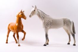 Two Beswick horses : a Palomino and a dapple grey,