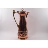 An Art Nouveau style copper and brass lidded jug, stamped factory mark to underside,