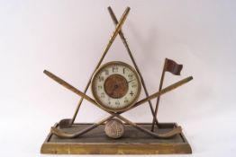 An early 20th century brass golfing mantel clock,