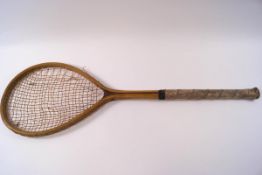 An early 20th century tennis racquet, stamped George G.