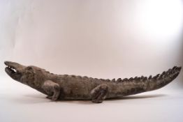 A lead garden sculpture of a crocodile,