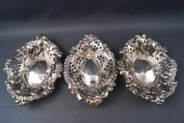 A pair of pierced and embossed silver bon bon dishes, 11.