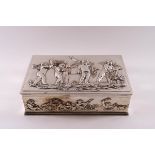 A silver plated rectangular box, with a design of cavorting cherubs in heavy relief,