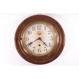 An American oak framed round wall clock, the dial marked Waterbury,