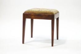 A 19th century mahogany stool with tapestry seat, on square tapering legs,