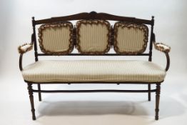 A Victorian mahogany and bentwood three piece salon suite with carved shell and scroll crest rails,