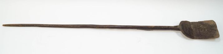A Scandinavian wooden shovel with carved decoration