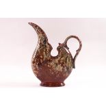 A Watcombe pottery jug in the manner of Christopher Dresser,