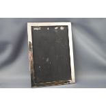 A rectangular silver photograph frame, lacking glass and easel back, Birmingham 1949,