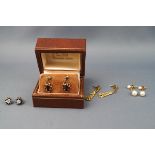A collection of earrings to include 9ct yellow gold garnet drops (1.