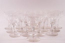 A suite of sixteen 19th century wine glasses, the bowls engraved with flowers and foliage,