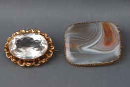 Two yellow gold mounted brooches consisting of a single banded agate with yellow mount and a single